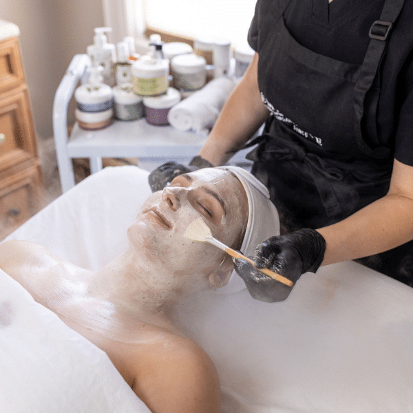 Women getting a facial at a spa