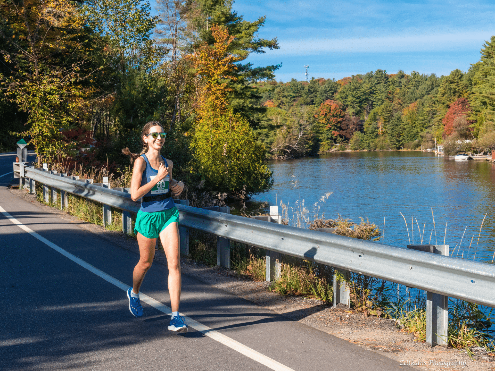 Runner along the muskoka river in the fall - Muskoka Marathon